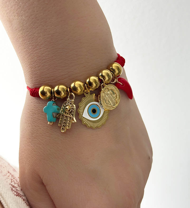 Hilo protección cruz turquesa