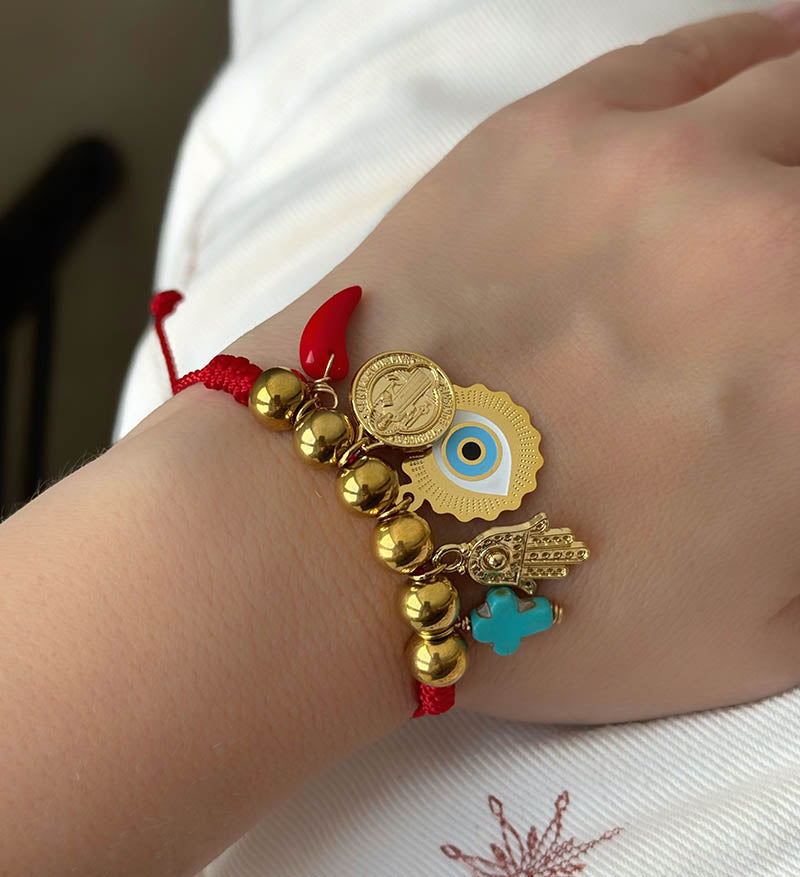 Hilo protección cruz turquesa