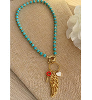 Collar turquesas y ala