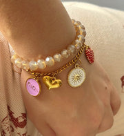 Pulsera doble champaña con charms