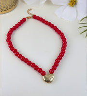 Collar rojo corazon dorado
